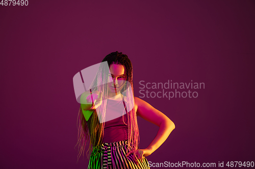 Image of Portrait of young caucasian woman on pink background with copyspace, unusual and freaky appearance