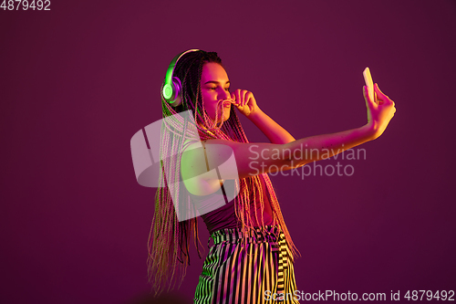 Image of Portrait of young caucasian woman on pink background with copyspace, unusual and freaky appearance