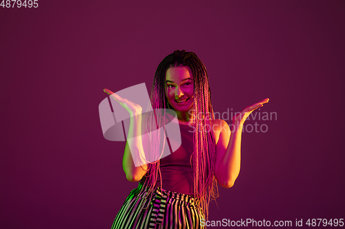 Image of Portrait of young caucasian woman on pink background with copyspace, unusual and freaky appearance