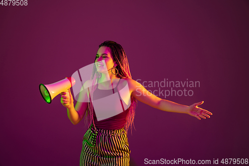 Image of Portrait of young caucasian woman on pink background with copyspace, unusual and freaky appearance