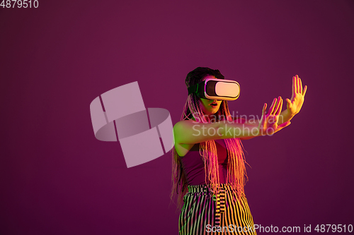 Image of Portrait of young caucasian woman on pink background with copyspace, unusual and freaky appearance