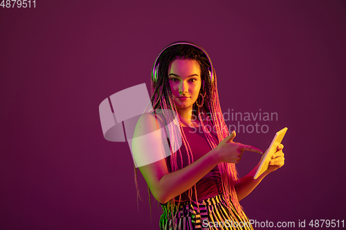 Image of Portrait of young caucasian woman on pink background with copyspace, unusual and freaky appearance