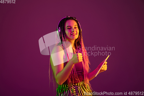 Image of Portrait of young caucasian woman on pink background with copyspace, unusual and freaky appearance