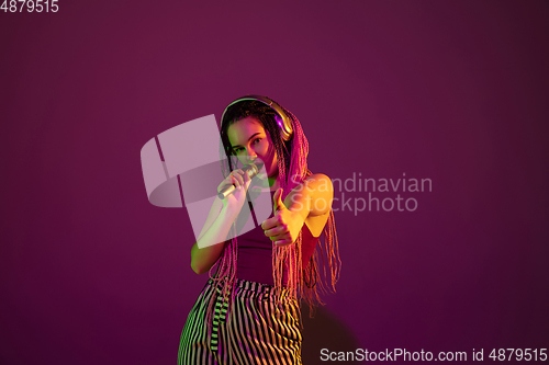 Image of Portrait of young caucasian woman on pink background with copyspace, unusual and freaky appearance