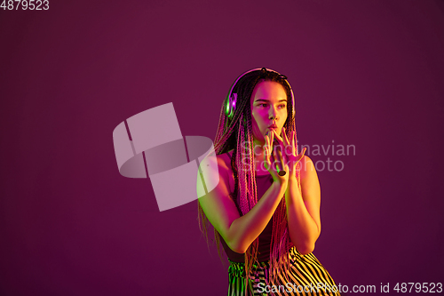 Image of Portrait of young caucasian woman on pink background with copyspace, unusual and freaky appearance