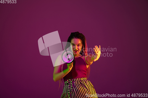 Image of Portrait of young caucasian woman on pink background with copyspace, unusual and freaky appearance