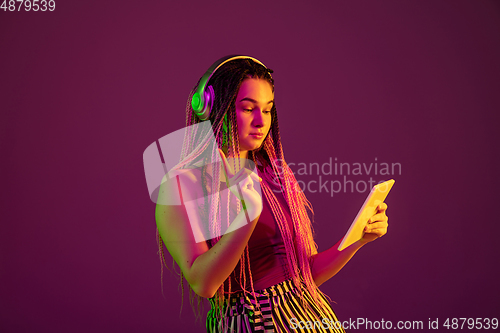 Image of Portrait of young caucasian woman on pink background with copyspace, unusual and freaky appearance