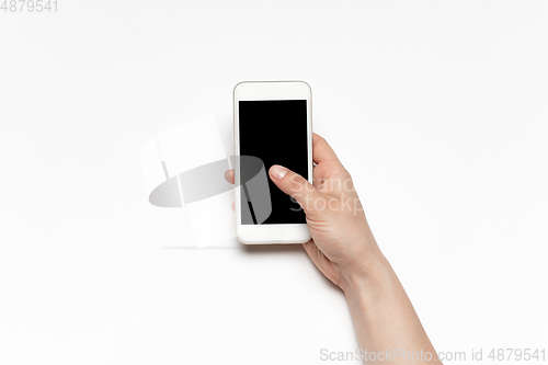 Image of Close up of human hand using smartphone with blank black screen, education and business concept
