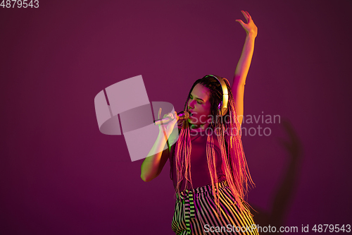 Image of Portrait of young caucasian woman on pink background with copyspace, unusual and freaky appearance