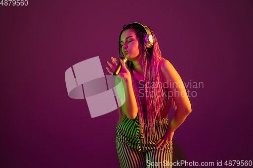 Image of Portrait of young caucasian woman on pink background with copyspace, unusual and freaky appearance