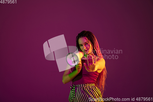 Image of Portrait of young caucasian woman on pink background with copyspace, unusual and freaky appearance