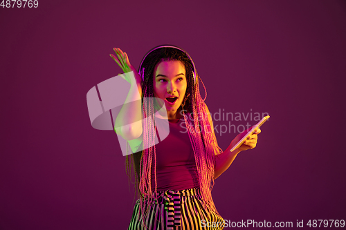 Image of Portrait of young caucasian woman on pink background with copyspace, unusual and freaky appearance