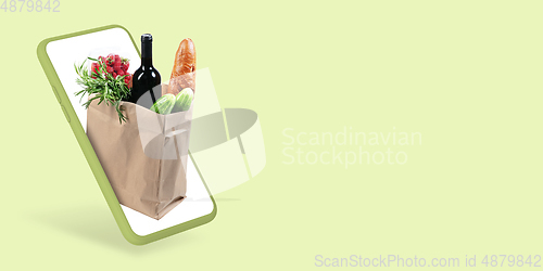 Image of Home delivery, food purchase via the Internet. Your smartphone or other gadget - all you need for food arriving to any address