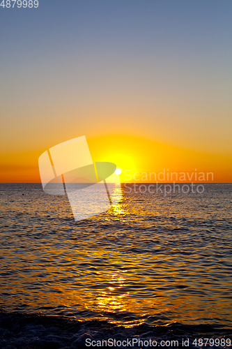 Image of Red sunset over the sea. Beautiful sunset.