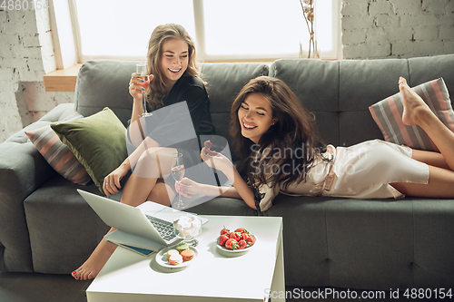 Image of Caucasian young and happy friends enjoying a weekend, little hen-party together