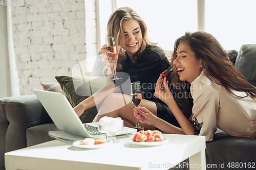 Image of Caucasian young and happy friends enjoying a weekend, little hen-party together