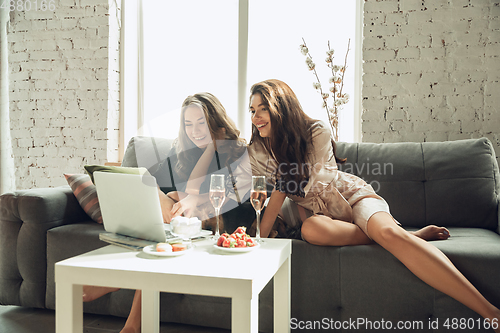 Image of Caucasian young and happy friends enjoying a weekend, little hen-party together