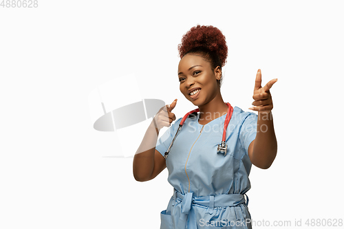 Image of Beautiful african-american doctor or nurse smiling isolated over white studio background