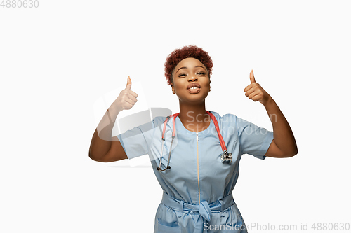 Image of Beautiful african-american doctor or nurse smiling isolated over white studio background