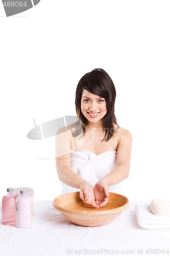 Image of Beautiful asian girl washing face