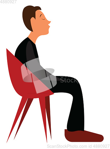 Image of A young boy waiting for someone while sitting on a red lounge ch