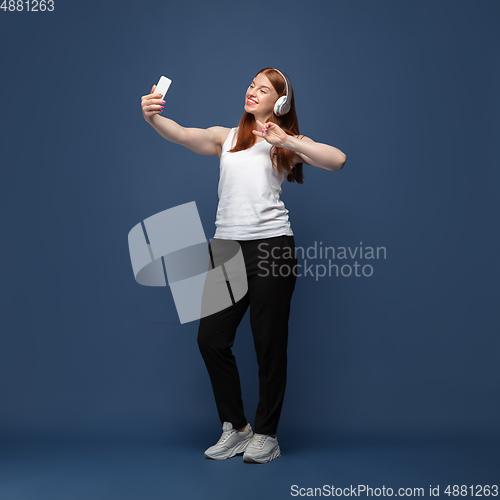 Image of Young caucasian woman in casual wear. Bodypositive female character, plus size businesswoman