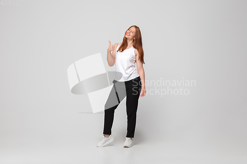 Image of Young caucasian woman in casual wear. Bodypositive female character, plus size businesswoman