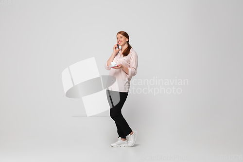 Image of Young caucasian woman in casual wear. Bodypositive female character, plus size businesswoman