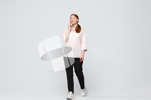 Image of Young caucasian woman in casual wear. Bodypositive female character, plus size businesswoman