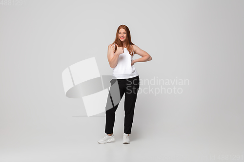 Image of Young caucasian woman in casual wear. Bodypositive female character, plus size businesswoman