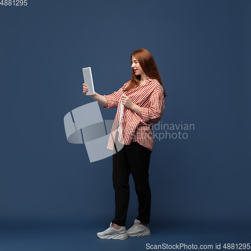 Image of Young caucasian woman in casual wear. Bodypositive female character, plus size businesswoman