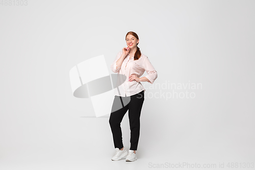 Image of Young caucasian woman in casual wear. Bodypositive female character, plus size businesswoman