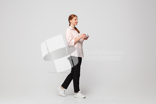 Image of Young caucasian woman in casual wear. Bodypositive female character, plus size businesswoman