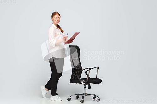 Image of Young caucasian woman in casual wear. Bodypositive female character, plus size businesswoman