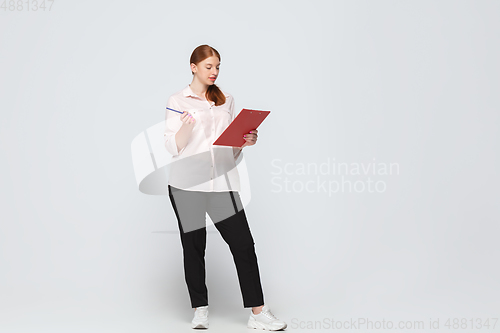 Image of Young caucasian woman in casual wear. Bodypositive female character, plus size businesswoman