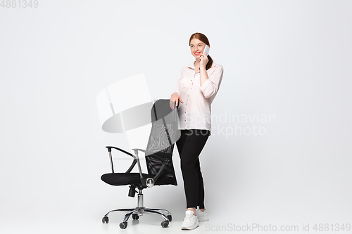 Image of Young caucasian woman in casual wear. Bodypositive female character, plus size businesswoman