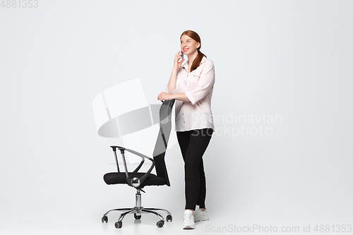 Image of Young caucasian woman in casual wear. Bodypositive female character, plus size businesswoman