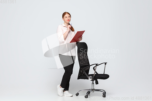 Image of Young caucasian woman in casual wear. Bodypositive female character, plus size businesswoman