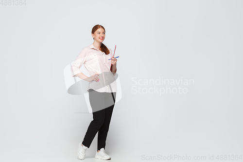 Image of Young caucasian woman in casual wear. Bodypositive female character, plus size businesswoman