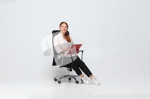 Image of Young caucasian woman in casual wear. Bodypositive female character, plus size businesswoman