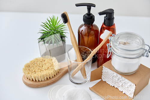 Image of wooden toothbrush, cotton pads and swabs in box