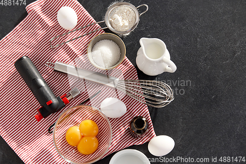 Image of whisk, eggs, sugar, milk, flour and vanilla