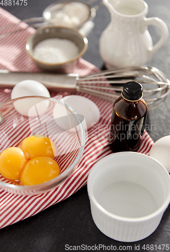 Image of whisk, eggs, sugar, milk, flour and vanilla