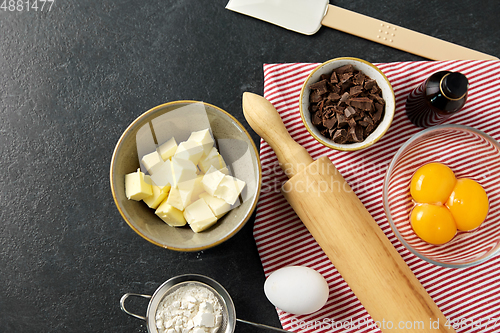 Image of rolling pin, butter, eggs, flour and chocolate