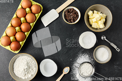 Image of rolling pin, butter, eggs, flour and chocolate