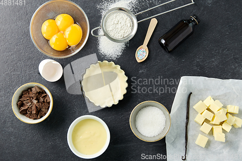 Image of baking dish with dough and cooking ingredients