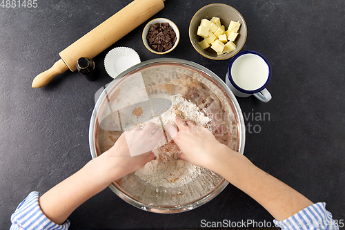 Image of chef or baker making dough at bakery