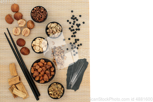 Image of Chinese Acupuncture Treatment with Needles and Herbs  