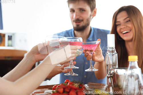 Image of Group of happy friends drinking vodka cocktails at boat party outdoor, cheerful and happy