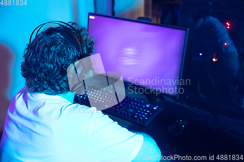 Image of Cyber sport. Fully concentrated professional cybersport player playing important match